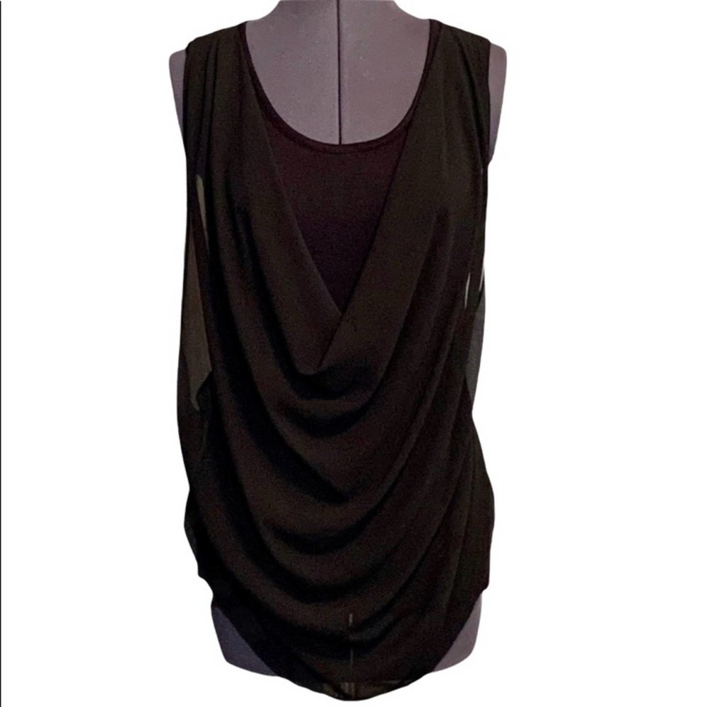 by x by sleeveless black shirt